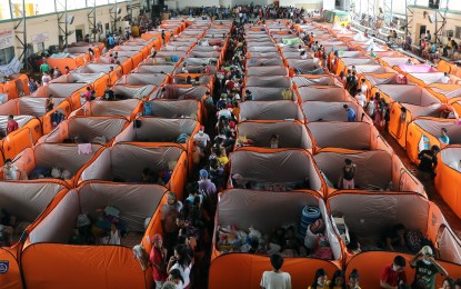 <p><strong>EVAC CENTER. </strong>The evacuation center at the compound of the Old Tanauan City Hall houses hundreds of locals affected by the recent eruption of the Taal Volcano on Friday (Jan. 17, 2020). The Quezon City government has provided the evacuees with modular cubicle tents. (<em>PNA photo by Joey O. Razon</em>) </p>