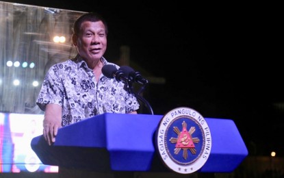 <p><strong>CEBU RAIL SYSTEM.</strong> President Rodrigo Duterte delivers a 20-minute speech at the Cebu City Sports Center Grandstand during the 40th Sinulog Grand Festival on Sunday (Jan. 19, 2020). In his speech, Duterte said Metro Cebu needs a rail system and skyways to address its traffic and transportation woes. <em>(Photo courtesy of Danjick Lim)</em></p>