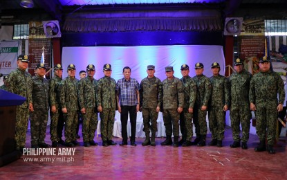 <p><strong>AID TO TAAL VICTIMS.</strong> AFP chief-of-staff Lt. Gen. Felimon T. Santos (7th from right) and Philippine Army (PA) commander, Lt. Gen. Gilbert Gapay (6th from right) accompany President Rodrigo Duterte during his visit to the victims of Taal Volcano's eruption at the PUP Campus in Sto. Tomas, Batangas on Monday (Jan. 20, 2020). Santos and Gapay, together with other government officials joined the President in delivering assistance to the affected families. <em>(Photo courtesy of Army Chief Public Affairs Office)</em></p>