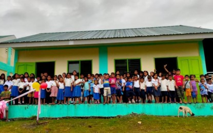 <p><strong>NEW CLASSROOMS</strong>. T’boli school children of Barangay Maan, T’boli town in South Cotabato province pose in front of a new two-classroom school building completed last year under the Department of Social Welfare and Development’s (DSWD) Kapit-Bisig Laban sa Kahirapan-Comprehensive and Integrated Delivery of Social Services or Kalahi-CIDSS program. The school building was constructed in partnership with the Department of Education. <em>(Photo courtesy of DSWD-12)</em></p>