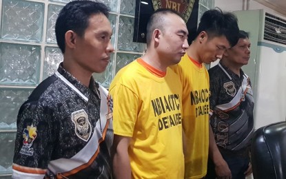 <p><strong>NABBED.</strong> NBI operatives present two Chinese nationals who allegedly run a prostitution den in a hotel in Makati City on Tuesday (Jan. 21, 2020). A total of 22 Chinese women were rescued from the brothel which caters only to Chinese clients. <em>(PNA photo by Benjamin Pulta)</em></p>