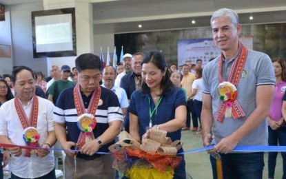 <p><strong>CARAVAN OF SERVICES.</strong> Cutting the ribbon to open the services caravan during the launching of the "Serbisyo Negrosanon" on Tuesday (Jan. 21, 2020) are (from left) environment department-Western Visayas Regional Executive Director Francisco Milla Jr., Interior Assistant Secretary for Peace and Order Manuel Felix, Isabela town Mayor Irene Montilla, and Negros Occidental Governor Eugenio Jose Lacson. The launching was to implement the Retooled Community Support Program and to further empower local government units in achieving peace and development. <em>(Photo courtesy of PIO Negros Occidental)</em></p>