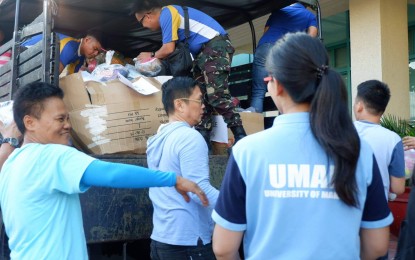 <p><strong>COMMUNITY SERVICE.</strong> The Philippine Air Force-Civil Military Operations and members of the Supreme Student Council Society of the Philippines deliver relief items to affected families of Taal's eruption in Malvar, Batangas on January 17 and 18. The military is encouraging the youth to do community service instead of joining militant groups. <em>(Contributed photo)</em></p>
