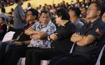 <p><strong>TRAFFIC WOES</strong>. President Rodrigo Duterte chats with Presidential Assistant for the Visayas, Secretary Michael Lloyd Dino during the Sinulog in Cebu City on Sunday (Jan. 19, 2020). Dino called on local officials to support the President's plan to put up a monorail and skyways to solve the traffic problem in Metro Cebu. <em>(Photo courtesy of Danjick Lim, OPAV)</em></p>