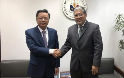 <p><strong>AID FOR TAAL ERUPTION VICTIMS.</strong> Chinese Ambassador Huang Xilian turns over the Embassy's RMB1-million assistance to those affected by the Taal Volcano eruption in Batangas. The turnover was made at the Department of Foreign Affairs together with Undersecretary Enrique Manalo. <em>(Photo courtesy of Chinese Embassy in Manila)</em></p>