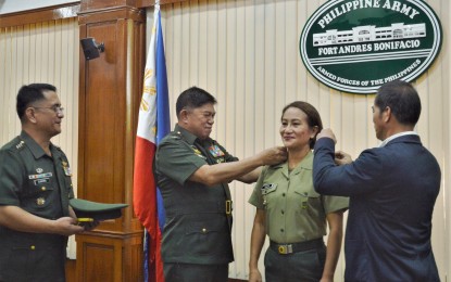 <p><strong>SERVE THE SERVANTS.</strong> Army chief, Lt. Gen. Gilbert Gapay leads the donning of ranks ceremony for Lt. Col, Leilanie Casa at the headquarters of the Philippine Army in Taguig City on Thursday (Jan. 23, 2020). Casa, senior vice president of the Air Materiel Wing Savings and Loan Association Incorporated (AMWSLAI), advocates for financial literacy among troops. <em>(Photo courtesy of Officer Marco Baliña)</em></p>