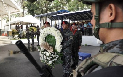 <p><strong>REMEMBERING SAF 44.</strong> National Police deputy chief for operations, Lt. Gen. Guillermo Eleazar, leads the wreath-laying ceremony to commemorate the heroism of the SAF 44 at the SAF headquarters in Taguig City on Saturday (Jan. 25, 2020). The 44 SAF commandos died in an encounter with Muslim rebels and private armed groups in Mamasapano, Maguindanao after neutralizing Malaysian terrorist Zulkifli bin Hir, alias Marwan, five years ago. <em>(PNA photo by Lloyd Caliwan)</em></p>