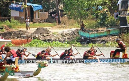 <p><strong>DRAGON BOAT</strong>. Dragon boat teams race to the finish line as spectators from the black sand quarry community look on. Cagayan de Oro-based Rapid Riders-Firebreathers attempt to win the Government and Corporate Category Finals on Saturday (Jan. 25, 2020) during the two-day 2nd Spring Festival Dragon Boat Race organized by Dragon Boat Kagay-an. The team landed third runner-up while the Cantilan, Surigao del Sur local government won the championship. <em>(Photo courtesy of Crizza A. Lagod)</em></p>