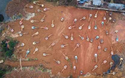 <p><strong>SPECIAL HOSPITAL</strong>. Aerial photo taken on Jan. 24, 2020 shows mechanical equipment working at the construction site of a special hospital in the Caidian District of western suburb of Wuhan, central China's Hubei Province. The central China metropolitan of Wuhan will follow Beijing's SARS treatment model to build a special hospital for admitting patients infected in the outbreak of pneumonia caused by the novel coronavirus. <em>(Photo courtesy of Xinhua/Xiao Yijiu)</em></p>