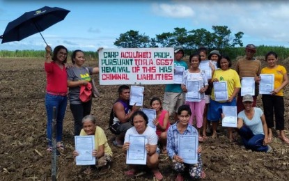 <p><strong>FARMER BENEFICIARIES.</strong> Some of the 64 farmer-beneficiaries installed on Jan. 24, 2020 by the Department of Agrarian Reform on 10 hectares of landholdings in E.B. Magalona town, Negros Occidental, previously owned by Precious Agricultural Corp. and formerly managed by the group of Abelardo Bantug III. The two properties of five hectares each are both located in Barangay Nanca. <em>(Photo courtesy of DAR Negros Occidental I-North)</em></p>