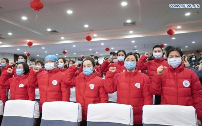 <p><strong>REINFORCEMENTS</strong>. Members of a medical team take part in an oath-taking ceremony before their departure to Wuhan of Hubei Province, in Nanning, south China's Guangxi Zhuang Autonomous Region, on Jan. 27, 2020. A team comprised of 137 medical workers from Guangxi left for Wuhan on Monday to aid the novel coronavirus control efforts there.<em> (Xinhua/Liang Shun)</em></p>