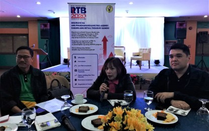 <p><strong>INVESTMENT OPPORTUNITIES</strong>. National Treasurer Rosalia de Leon (center) explains to Baguio media on Wednesday the retail treasury bond-23 to encourage even the ordinary Filipinos to invest in secured bonds for government projects with just PHP5,000 and earn an interest of 4.375 percent. Also in the photo are Gonzalo Benjamin Bongolan of LandBank (left) and Francis Nicolas Chua of the Development Bank of the Philippines (right).<em> (PNA photo by Liza T. Agoot)</em></p>