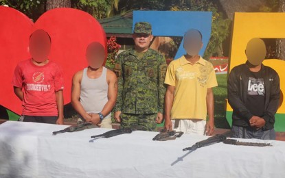 <p><strong>FORMER REBELS.</strong> Lt. Col. Warren Munda, commander of the Army's 75th Infantry Battalion, welcomes the four members of the communist New People’s Army who surrendered in Barangay Maharlika, Bislig City, Surigao del Sur on January 27, 2020. Munda called on the remaining rebels in the hinterlands to return to the fold of the law. <em>(Photo courtesy of 75IB)</em></p>