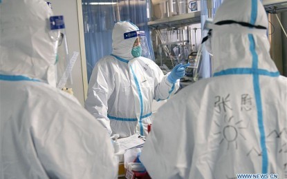 <p><strong>2019 n-CoV.</strong> Peng Zhiyong, head of the department of critical care medicine of Zhongnan Hospital, performs diagnosis on a patient with his colleagues in Zhongnan Hospital of Wuhan University in Wuhan, central China's Hubei province on Jan. 24, 2020. Hubei province reported 105 new confirmed cases of pneumonia caused by the novel coronavirus (2019-nCoV), provincial health authorities said last week. <em>(Xinhua photo/Xiong Qi)</em></p>