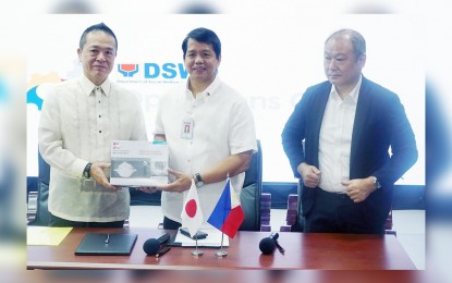 <p><strong>DONATION FOR TAAL VICTIMS.</strong> Department of Social Welfare and Development (DSWD) Secretary Rolando Joselito Bautista (center), Embassy of Japan Charge d Affaires Yamamoto Yasushi (left), and Japan International Cooperation Agency (JICA) Chief Representative Wada Yoshio (right), during the signing of a deed of donation held at the DSWD Operation Center Building in Batasan, Quezon City on Wednesday (Jan. 29, 2020). Japan donated various implements for residents affected by the eruption of Taal Volcano in Batangas last January 12, 2020. <em>(PNA photo by Ben Briones)</em></p>