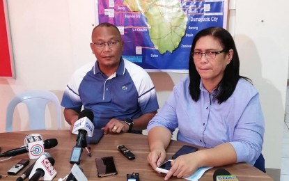 <p><strong>CLASSES SUSPENDED</strong>. Negros Oriental Governor Roel Degamo signed on Tuesday afternoon an executive order suspending classes in all public schools in the province at all levels from Wednesday to Friday (Feb. 5-7, 2020). Bimbo Miraflor, Capitol spokesperson, and Dr. Liland Estacion, Assistant Provincial Health Officer, are shown making the announcement during a press briefing on the novel coronavirus at the Provincial Health Office. <em>(Photo by Judy Flores Partlow)</em></p>