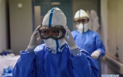 <p><strong>PROTECTED</strong>. Nurses put on protective goggles outside a ward in Beijing Ditan Hospital in Beijing, capital of China, Feb. 3, 2020. The Beijing Ditan Hospital, a designated hospital to treat patients infected with the novel coronavirus in the city, has opened three general wards and one intensive care unit to fight the new coronavirus outbreak. (<em>Photo by Peng Ziyang/Xinhua)</em></p>