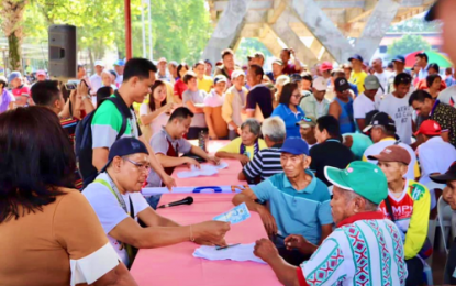 <p><strong>AID TO FARMERS.</strong> Farmer beneficiaries of the Department of Agriculture-Expanded Survival and Recovery Assistance Program for Rice Farmers from North Cotabato queue to receive their loan assistance from the government on Monday (Feb. 3, 2020) in Midsayap, North Cotabato. Beneficiaries consider the loan assistance as “blessing” that came at the time they needed it most when prices of palay had been dropping low. <em>(Photo courtesy of North Cotabato PIO)</em></p>