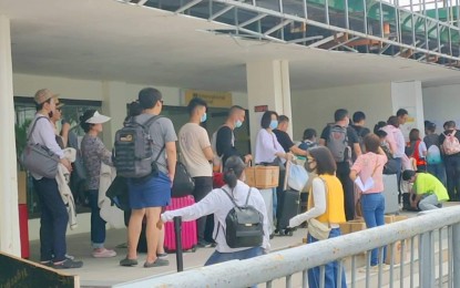 <p><strong>MEASURES VS. nCoV.</strong> Photo shows the passengers at the arrival area of Kalibo International Airport. Domestic and international passengers undergo thermal scanning as a precautionary measure against the entry of the novel coronavirus, said Eusebio Monserate, airport manager of Kalibo International Airport, on Wednesday (Feb. 5, 2020). <em>(Contributed photo)</em></p>