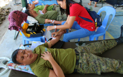 <p><strong>GIVING BLOOD.</strong> Army soldiers belonging to the Army’s 40th Infantry Battalion (IB) lay down on camp beds while being attended to by a Philippine Red Cross (PRC) staff member during a bloodletting activity on Wednesday (Feb. 5, 2020) inside the headquarters of the 40IB in President Quirino, Sultan Kudarat. The PRC managed to collect 38 blood bags from the soldiers. <em>(Photo courtesy of 40IB)</em></p>