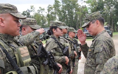 <p><strong>RALLYING THE TROOPS.</strong> Maj. Gen. Eric Vinoya (right), commander of the Philippine Army’s 3rd Infantry Division, rallies the troops of the 12th Infantry Battalion (12IB) during the start of their organizational training on Monday (Feb. 3, 2020). The 12IB will be converted to a maneuver battalion, which will provide Panay Island with more foot soldiers to fight insurgency.<em> (Photo courtesy of 3ID Public Affairs Office)</em></p>