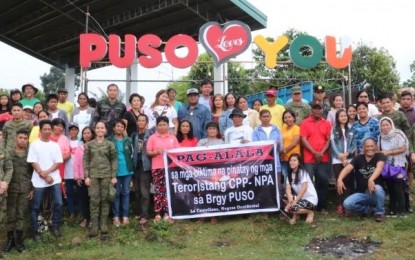 <p><strong>REMEMBERING THE VICTIMS.</strong> Residents of Barangay Puso in La Castellana, Negros Occidental, together with town officials led by Mayor Rhumyla Nicor-Mangilimutan and personnel of the Philippine Army and the Philippine National Police, on Thursday (Feb. 6, 2020) remember the victims of the massacre in their village, which killed eight civilians and a policeman and injured 12 others, seven years ago. The ambush was perpetrated by the New People’s Army while the victims were on their way home from a fiesta in a neighboring village on Jan. 27, 2013. <em>(Photo courtesy of Philippine Army, 303rd Infantry Brigade)</em></p>