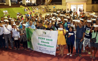 <p><strong>AID TO COCO FARMERS.</strong> Over PHP1.5 million financial aid is released to 264 coconut farmers from 14 barangays in Bayugan City, Agusan del Sur, on Wednesday (February 5). The assistance is part of the continuing 2018 Participatory Coconut Planting Project (PCPP) implementation of the Philippine Coconut Authority in Caraga Region. <em>(PNA photo by Alexander Lopez)</em></p>