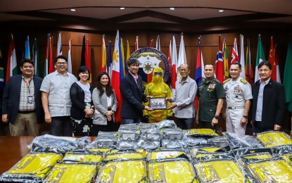 <p><strong>BIOHAZARD SUIT DONATION.</strong> Defense Secretary Delfin Lorenzana (4th from right) and AFP Chief of Staff, Gen. Felimon Santos Jr. (3rd from right), receive the biohazard suit donation from a representative of the LT Group and PMFTC in a ceremony in Camp Aguinaldo, Quezon City on Friday (Feb. 7, 2020). The donation contains 200 pieces of biohazard suits, boots, and goggles. <em>(Photo courtesy of DND Public Affairs Service)</em></p>