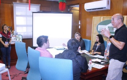 <p><strong>MEETING ON nCoV</strong>. Vice Mayor El Cid Familiaran (right), chair of the Bacolod City Inter-Agency Task Force Against the Novel Coronavirus (nCoV), and Dr. Grace Tan of the City Health Office (left) meet with the managers and representatives of hotels in Bacolod last week to discuss measures on how hotel operators could respond quickly and start introducing preventive measures against the deadly nCoV. As of Monday (Feb. 10, 2020) afternoon, six patients under investigation were admitted to tertiary hospitals in the city while three have already been discharged since last week. (<em>Photo courtesy of Bacolod City PIO</em>) </p>