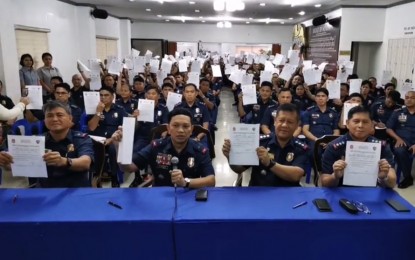 <p><strong>NO-TAKE POLICY</strong>. Police Regional Office (PRO-7) Director, Brig. Gen. Albert Ignatius Dacoco Ferro, leads heads of command groups and chiefs of police in signing an affidavit promising not to take bribe out of any illegal drug and gambling operations at the regional headquarters in Camp Sergio Osmeña in Cebu City on Monday (Feb. 10, 2020). Ferro said any chief of police who will be caught violating their signed affidavit will be relieved, investigated and charged with the proper administrative case. <em>(Photo from the PRO-7 Facebook page)</em></p>