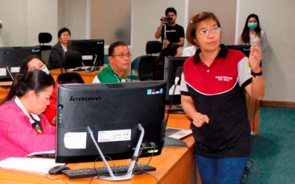 <p><strong>nCoV UPDATES</strong>. Dr. Grace Tan (standing, right), spokesperson of the Bacolod City inter-agency task force against the novel coronavirus acute respiratory disease (2019-nCoV ARD), discusses updates on local efforts to curb the outbreak during a meeting with members on Monday (Feb. 10, 2020). As of Tuesday, two out of the six latest patients under investigation admitted in tertiary hospitals in Bacolod have been discharged after being found negative for nCoV. <em>(Photo courtesy of Bacolod City PIO)</em></p>
