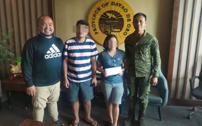 <p><strong>NEW LIFE.</strong> Couple Bart and Joy, former members of the communist New People's Army, receive financial assistance from Davao de Oro Governor Jayvee Tyron Uy (extreme left) on Monday (February 10, 2020). With them is Lt. Col. Roman Mabborang, commander of the Army's 66th Infantry Battalion.  <em>(Photo courtesy of Eastmincom)</em></p>