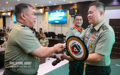 <p><strong>NEW OG-9 ACTING CHIEF.</strong> Col. Francis Carter Sibal (left) receives the official seal of the Office of the Assistant Chief of Staff for Reservist and Retiree Affairs (OG-9) from PA chief Brig. Gen. Rowen Tolentino (right) in a change of office ceremony in Fort Bonifacio, Taguig City on Monday (Feb. 10, 2020). Sibal replaced outgoing chief Col. Danilo Cariño (center) who was appointed as the new deputy chief of the Tarlac-based Training and Doctrine Command. <em>(Photo courtesy of Army Chief Public Affairs Office)</em></p>