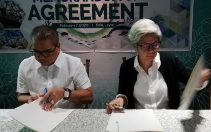 <p><strong>SIGNED DEAL.</strong> Bureau of Fisheries and Aquatic Resources (BFAR) 8 (Eastern Visayas) Director Juan Albaladejo (left) and Rare, Inc. Vice President for Philippines Raquel Sanchez Tirona sign a memorandum of agreement on capacitating stakeholders on fishery management on Feb. 7, 2020. The deal is expected to help curb the depleting catch in fishery management areas in the Eastern Visayas and Caraga regions. <em>(BFAR photo)</em></p>
