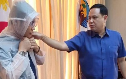 <p><strong>DEFENSE VS. VIRUS.</strong> Iloilo Governor Arthur Defensor Jr. checks one of the personal protective equipment of health personnel in case there will be a person under investigation for coronavirus disease 2019 (Covid-19) in the province. To boost the province's defense against the virus, Defensor on Wednesday (Feb. 12, 2020) ordered the procurement of 20 infrared thermometers that will be used to check the temperature of incoming passengers in the provincial seaports. <em>(Photo courtesy of Capitol PIO)</em></p>