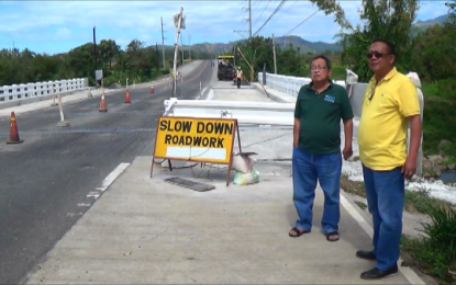 <p><strong>BRIDGE INSPECTION.</strong> Municipal administrator Nick Ancheta (right) inspects on Thursday, Feb. 13, 2020, the unfinished Umagol Bridge project in Bagac, Bataan. The Department of Public Works and Highways (DPWH said the rough surface of the bridge will be smoothened and that the project will soon be completed. <em>(Photo by Ernie Esconde)</em></p>