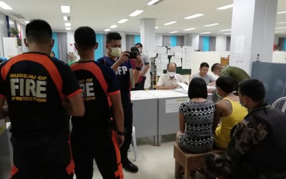 <p><strong>ARSON CHARGES</strong>. Police and Bureau of Fire personnel file a complaint of destructive arson against live-in partners Rogen Monceda and Luisa Mateo at the City Prosecutor's Office in Dumaguete City on Thursday (Feb. 13, 2020). The case is in relation to a fire that razed some 55 houses in Barangay Calindagan last Feb. 12, 2020. <em>(Photo by Judy Flores Partlow)</em></p>