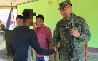 <p><strong>NEW LIFE.</strong> One of the three fighters of the radical group Bangsamoro Islamic Freedom Fighters – Karialan faction, shakes hands with Lt. Col. Neil Roldan, commander of the Army's 7th Infantry Battalion, during a surrender on Thursday (Feb. 13, 2020). The surrenderers, all of Barangay Barungis, Pikit, North Cotabato, yielded firearms and an explosive. <em>(Photo courtesy of 7IB)</em></p>