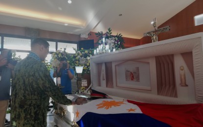 <p><strong>REVENGE FOR ESPANTO</strong>. Philippine National Police (PNP) Chief, Gen. Archie Francisco Gamboa pays respect to the remains of Captain Efren Espanto Jr. at Camp Delgado in Iloilo City on Saturday (Feb. 15, 2020). Gamboa ordered to launch offensive attack against the communist rebels who killed Espanto on February 12. <em>(PNA photo by Gail Momblan)</em></p>