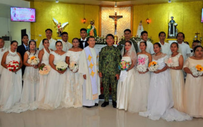 <p><strong>COPS GET HITCHED ON V-DAY.</strong> Brig. Gen. Marni Marcos Jr., Bangsamoro Autonomous Region in Muslim Mindanao director, and Lt. Col. Victorino Belangdal, Police Regional Pastoral Office Chaplain (center) pose with the 10 newly-wed couples during the Valentine's Day mass wedding at Camp SK Pendatun, Parang, Maguindanao. Dubbed as the Kasalang Bayan 2020 , the annual activity seeks to provide free wedding with reception services to police personnel and their partners. <em>(Photo courtesy of PRO-BARMM)</em></p>
<p> </p>
<p><em> </em></p>