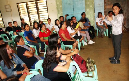<p><strong>'DEFEND OUR CHILDREN'.</strong> Agusan del Norte 2nd District Rep. Ma. Angelica M. Amante-Matba (standing, right) urges teachers of Durian National High School in Las Nieves, Agusan del Norte to help the government protect the youth from the influence of the New People’s Army (NPA), during a visit on Saturday (Feb. 15. 2020). She also visited Sangay National High School in Buenavista town on the same day. <em>(PNA photo by Alexander Lopez)</em></p>