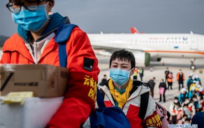 <p><strong>MEDICAL SUPPORT</strong>. Medical team members board the flight to Hubei Province at Changshui International Airport in Kunming, capital of southwest China's Yunnan Province, Feb. 16, 2020. The fifth batch of 108 medical workers from Yunnan left for Hubei Province on Sunday to aid the novel coronavirus control efforts there. <em>(Xinhua/Hu Chao)</em></p>