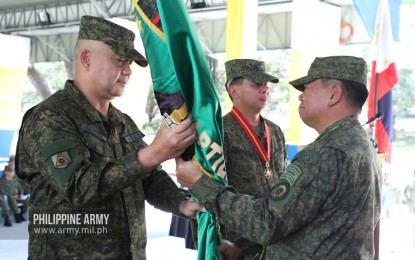 <p><strong>NEW AAR ACTING HEAD.</strong> Philippine Army (PA) commander, Lt. Gen. Gilbert Gapay Jr., (right) turns over the flag of the Army Artillery Regiment (AAR) to its new acting commander, Col. Romulo Manuel Jr., (left) in a change-of-command ceremony in Fort Magsaysay, Nueva Ecija on Monday (Feb. 17, 2020). Manuel replaced Brig. Gen. Virgilio Bartolome (middle) who bowed out of the service upon reaching the mandatory retirement age of 56. <em>(Photo courtesy of Army Chief Public Affairs Office)</em></p>