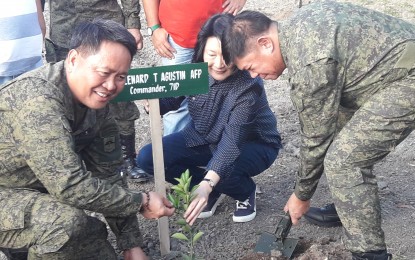 <p><strong>GARDEN.</strong> Maj. Gen. Lenard Agustin, division commander of the Army's 7th Infantry Division; Dr. Isabel Cojuangco-Suntay, chairperson of the Tarlac Heritage Foundation; and Lt. Gen. Gilbert Gapay, commanding general of the Philippine Army (from left to right) lead the ceremonial tree planting during the inauguration and blessing of another site of Hardin ng Lunas at Fort Magsaysay, Palayan City, Nueva Ecija on Monday (Feb. 17, 2020). Hardin ng Lunas, a joint undertaking of the Philippine Army and the Tarlac Heritage Foundation, aims to develop idle camp lands to make them productive for the benefit of military personnel and their dependents.<em> (Photo by Jason de Asis)</em></p>