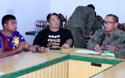 <p><strong>FULL SUPPORT.</strong> Board Member Eddie Sulhayan Ampiyawan (left), the Indigenous Peoples’ Mandatory Representative of Agusan del Norte, joins NCIP-13 director Ferdausi Cerna (center) and the Army's 23rd Infantry commander, Lt. Col. Francisco Molina Jr. (right) in a meeting on February 16 in Buenavista town. The officials discussed moves to support the Army-led government effort to counter the recruitment campaign of the communist New People’s Army in schools. <em>(PNA photo by Alexander Lopez)</em></p>