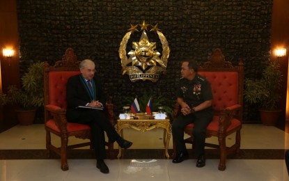 <p><strong>RUSSIAN ENVOY VISITS AFP CHIEF.</strong> Russian Ambassador to the Philippines Igor Khovaev (left) exchanges pleasantries with Armed Forces of the Philippines (AFP) chief-of-staff Gen. Felimon Santos Jr. (right) in an "introductory courtesy call" in Camp Aguinaldo on Monday (Feb. 17, 2020). The Russian Embassy in Manila said Khovaev's visit is part of efforts to intensify cooperation between Russia and the Philippines.<em> (Photo courtesy of AFP Public Affairs Office)</em></p>
