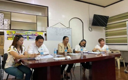<p><strong>EMERGENCY MEETING</strong>. Mayor Mary Marlyn Lambino (middle) leads an emergency meeting on Feb. 17, 2020, to tackle the confirmed cases of African swine fever (ASF) in the town. Lambino immediately issued an Executive Order for the mandatory blood sampling of all pigs in the town and the ban on entry and exit of swine and other pork products. <em>(Photo courtesy of Councilor Aldrin Soriano's Facebook page)</em></p>