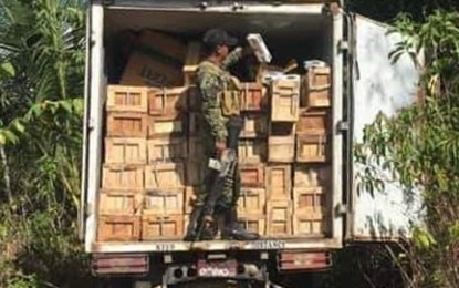 <p><br />SMUGGLED CIGARETTES. A soldier inspects a mini wing van loaded with some PHP2.4 million worth of smuggled cigarettes mixed with boxes of dried fish the authorities seize Thursday (Feb. 20, 2020) in Barangay San Vicente, Tungawan, Zamboanga Sibugay. The driver was not around when authorities arrived to confiscate the items. <em>(Photo courtesy of Tungawan Mayor Carlnan Climaco)</em></p>