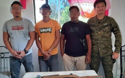 <p><strong>SURRENDERED.</strong> Two Abu Sayyaf Group bandits identified as Nakib Asmad (2nd from left) and Suwaib Mungkay (2nd from right) surrender in Hadji Mohammad Ajul town, Basilan province on Thursday (Feb. 20, 2020). Mayor Ibrahim Ballajo (left) and Capt. James Dipdip (right), commander of the 19th Special Forces Company of the Army's 4th Special Forces Battalion, facilitated their surrender. <em>(Photo courtesy of the Western Mindanao Command Public Information Office)</em></p>