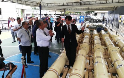 <p><strong>TUNNEL BORING MACHINE.</strong> Department of Transportation (DOTr) Secretary Arthur Tugade (2nd from left) listens to a presentation by a representative of the Metro Manila Subway's tunnel boring machine (TBM) manufacturer, JIM Technology, Inc. (JIMT) at the Manila International Airport Administration Compound in Pasay City on Monday (Feb. 24, 2020). DOTr Undersecretary for Railways Timothy John Batan said the first of six TBMs ordered by the government for the project will reach Manila in August, about four months ahead of schedule. <em>(Photo by Raymond Carl Dela Cruz)</em></p>